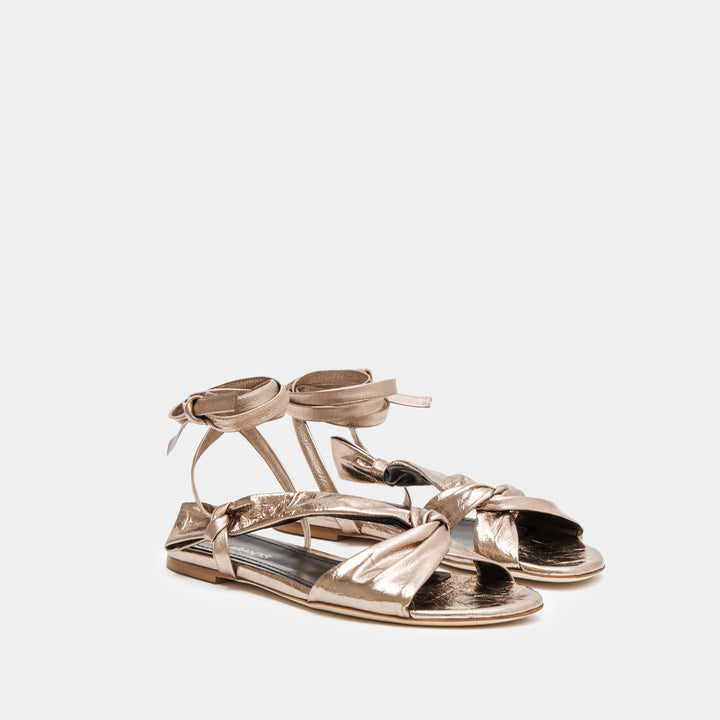 Bronze metallic Knotted nappa flat sandal with an ankle tie wrap
